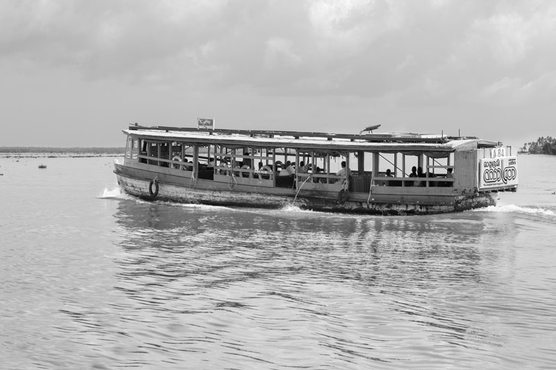 Living Below the Sea Level - large motorized ferry carrying passengers on a routine trip in Alappuzha district, Kerala